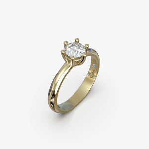 Forlovelsesring i 18 kt gult guld med naturlig diamant 0,50 ct., set fra siden