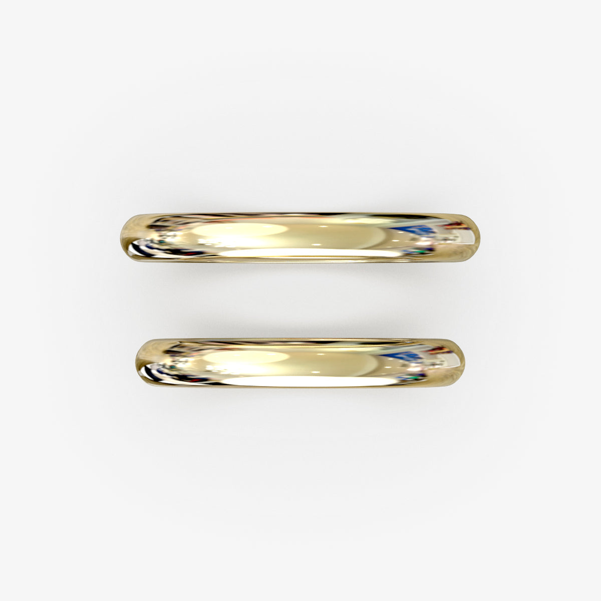 Vielsesringe i 18 kt gult guld med klassisk profil og blå diamant, set oppefra