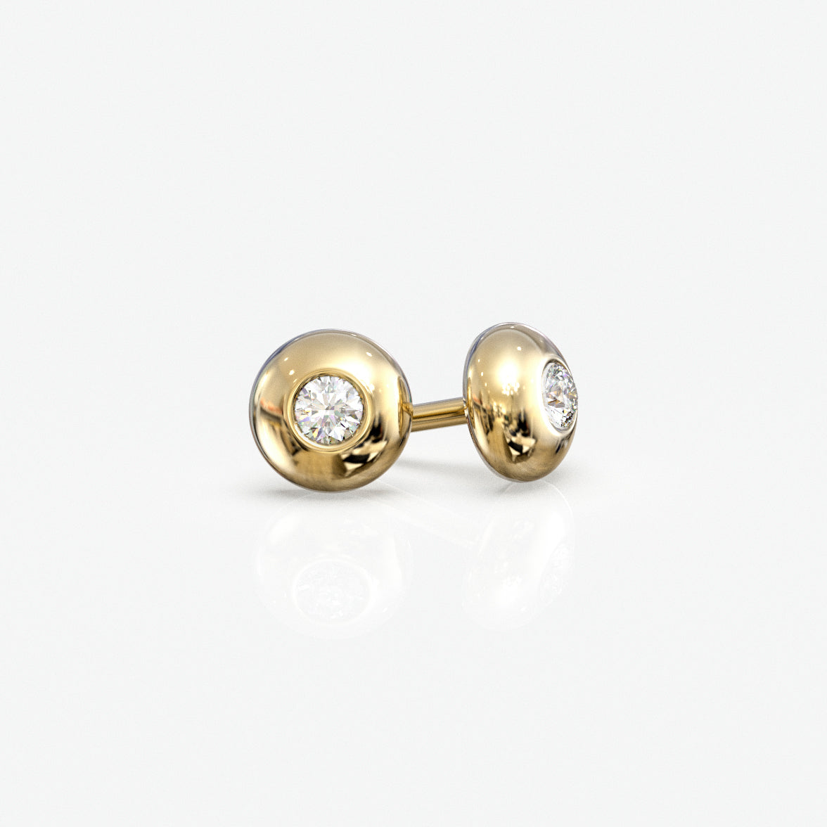 Diamantørestikker i 18 kt gult guld, 0,06 ct. pr. par, set fra siden
