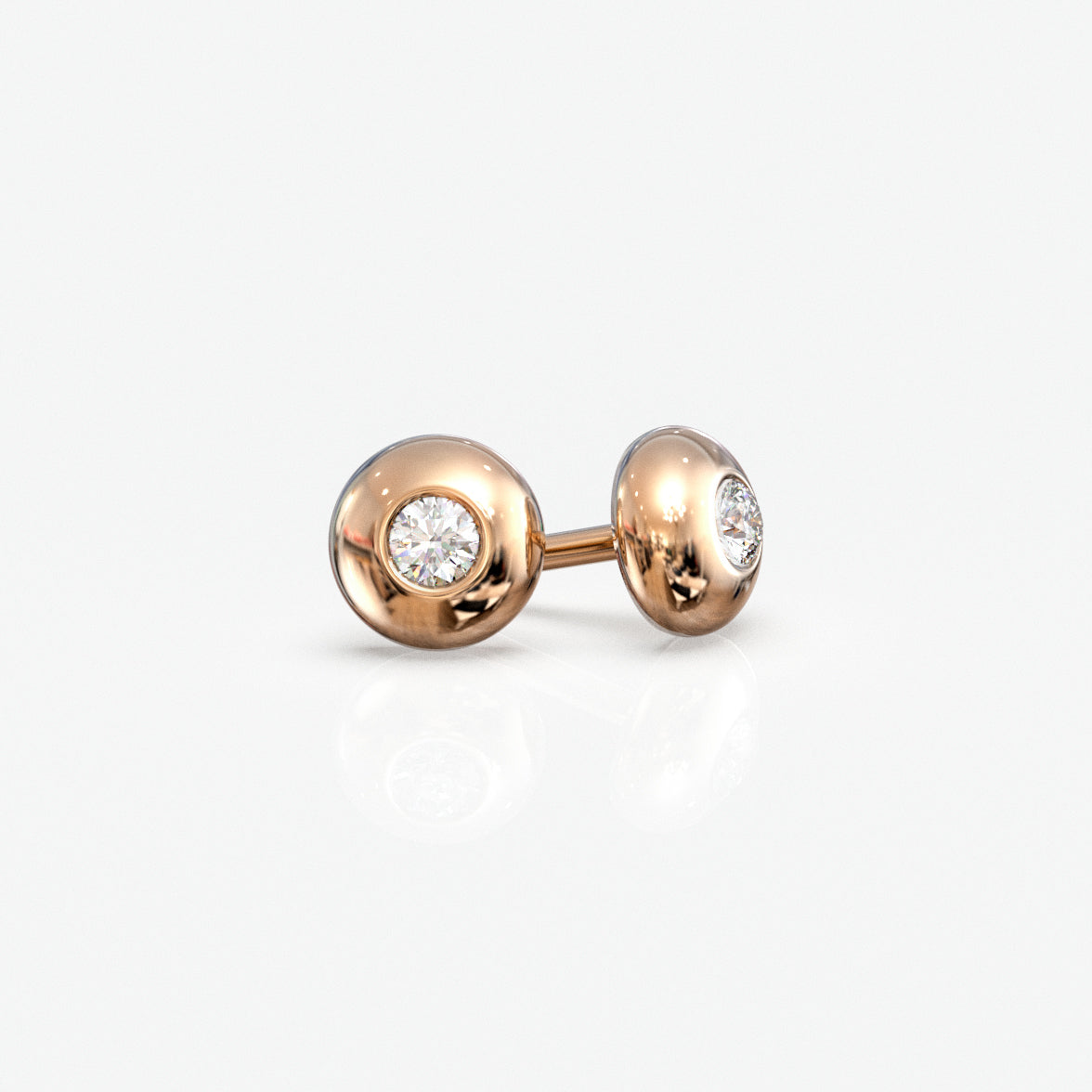 Diamantørestikker i 18 kt rosaguld, 0,06 ct. pr. par, set fra siden